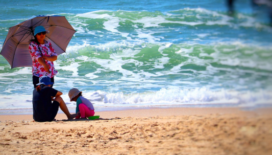 Woman standing under the umbrella