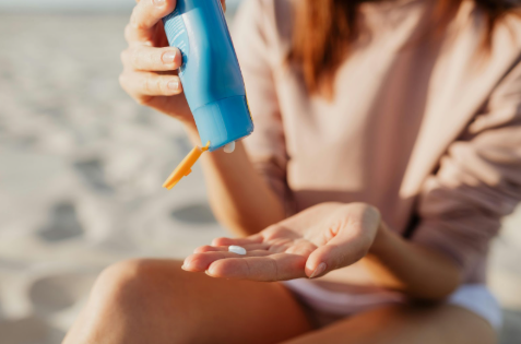 Close-up of sunscreen being dispensed into a hand
